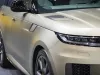 View of front of Range Rover, showing detail and part of vehicle